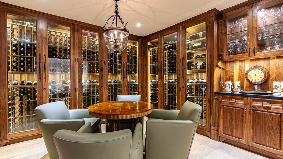 The wine tasting room has a table and chairs in the center.