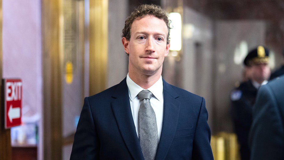 Mark Zuckerberg walks into the Senate hearing room