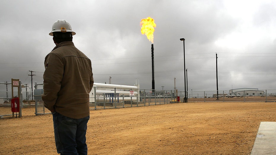 Natural gas burns at a plant on the Permian Basin in Garden City, Texas