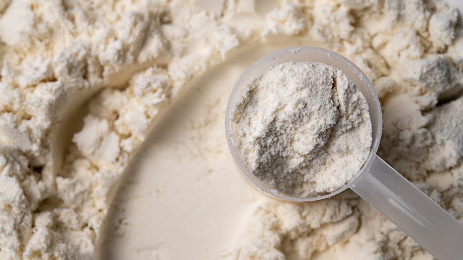 Protein whey powder with scoops. Food supplement, bodybuilding, fitness and gym lifestyle.
