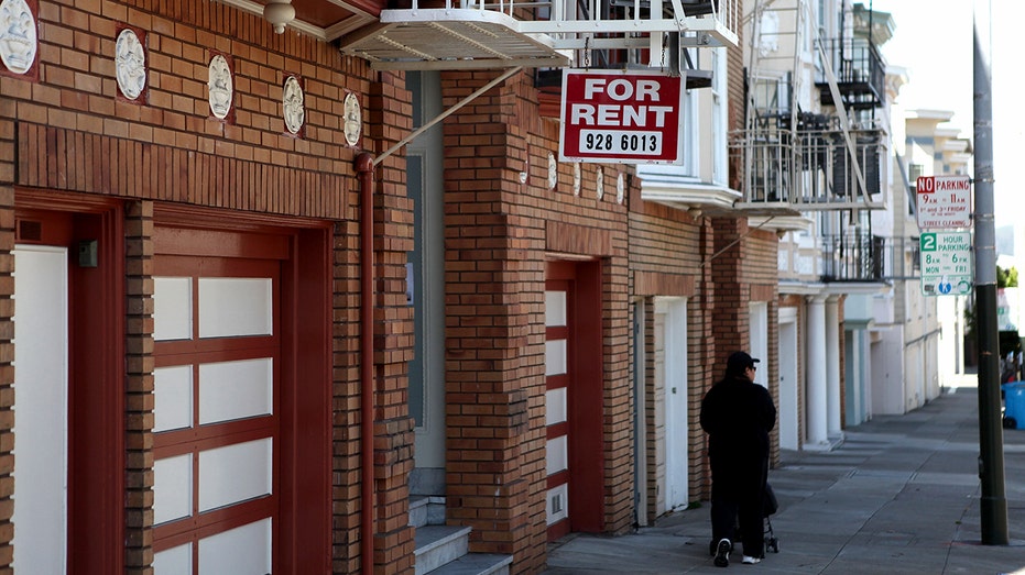 A sign advertising an apartment for rent.