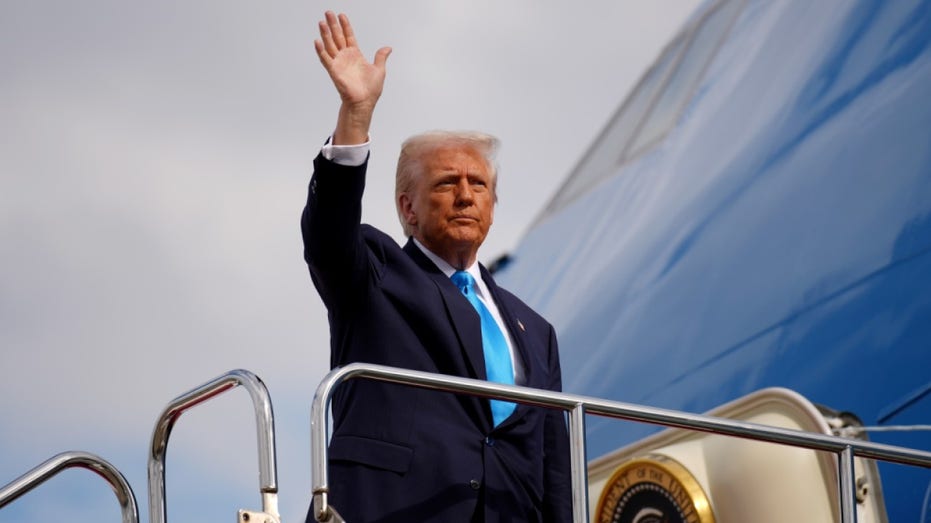 President Donald Trump boards Air Force One as he prepares to depart for South Korea at Haneda Airport on October 29, 2025 in Tokyo, Japan.