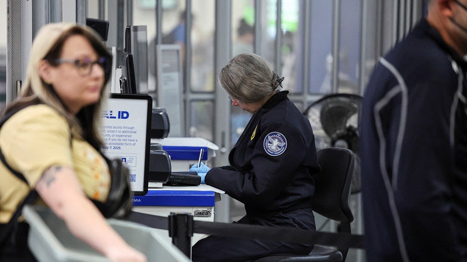 Transportation Security Administration (TSA) works during the first day of a partial U.S. government shutdown in Burbank