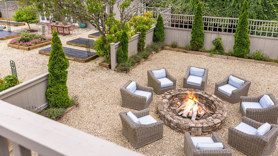 The property features many outdoor lounge areas, including the fire pit.