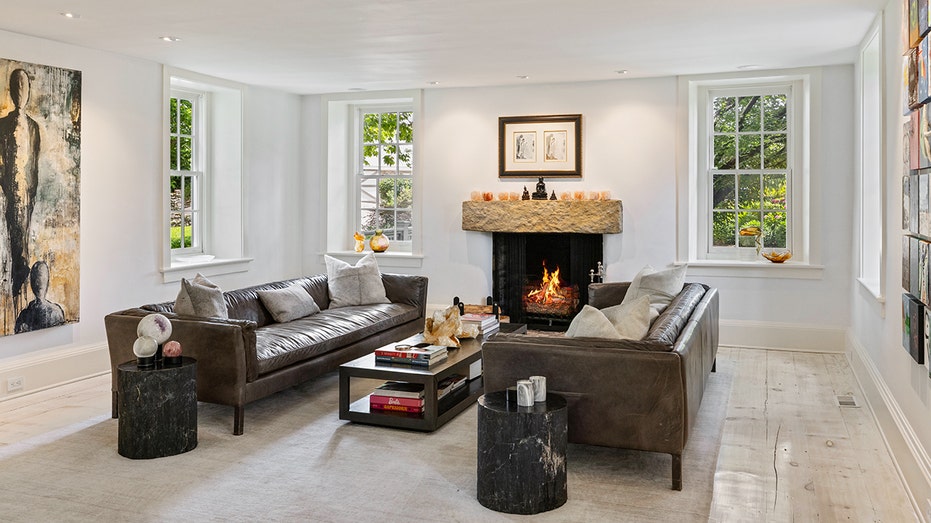 The living room features a wood-burning fireplace.