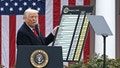 President Donald Trump delivers remarks on reciprocal tariffs as US Secretary of Commerce Howard Lutnick holds a chart during an event in the Rose Garden. On Friday, Trump announced the rollback of tariffs on certain imported goods. - Fox News