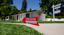 An "Open House" sign in front of a home for sale in the Woodland Hills neighborhood of Los Angeles, California on July 13, 2025.  - Fox Business News