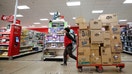 An employee pulls a wheeler to restock shelfs at a Target store in Chicago on November 26, 2024, ahead of the Black Friday shopping day. (Photo by KAMIL KRZACZYNSKI / AFP) (Photo by KAMIL KRZACZYNSKI/AFP via Getty Images) - Fox Business News