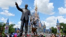 A statue of Walt Disney and Mickey Mouse stands in a garden in front of Cinderella's Castle at the Magic Kingdom Park at Walt Disney World on April 3, 2025, in Orlando, Florida.  - Fox Business News