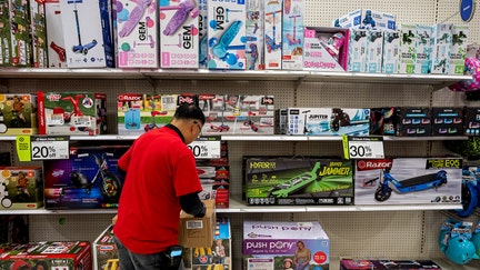 A worker stocks shelves in a toy aisle inside a Target store at the Serramonte Mall on Black Friday in Daly City, California, US, on Friday, Nov. 28, 2025. Americans are planning to spend more this holiday season than last year, according to credit reporting firm TransUnion. Photographer: David Paul Morris/Bloomberg via Getty Images - Fox Business News