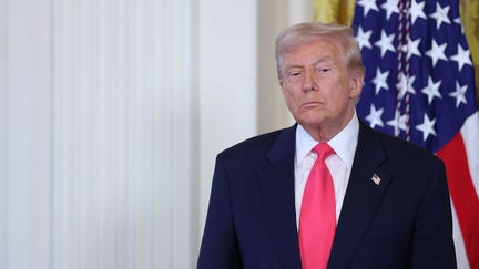 President Donald Trump listens as first lady Melania Trump speaks at a signing ceremony for the "Fostering the Future" executive order in the East Room of the White House on November 13, 2025 in Washington, DC. The executive order, championed by the first lady, works to expand opportunities for education, career development, housing and other resources for youth transitioning from foster care to adulthood. (Photo by Anna Moneymaker/Getty Images) - Fox Business News