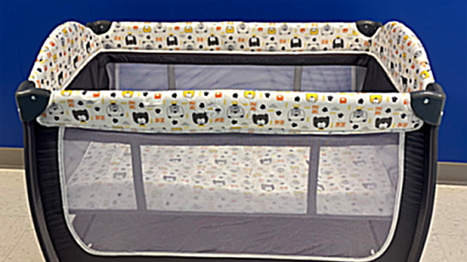 Children's play yard set up in room