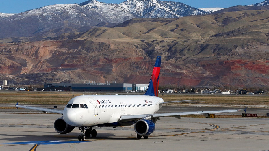 A Delta Airlines passenger jet taxis at the Salt Lake City international airport