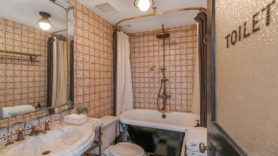 A vintage bathroom with a soaking tub can be found on the first floor.