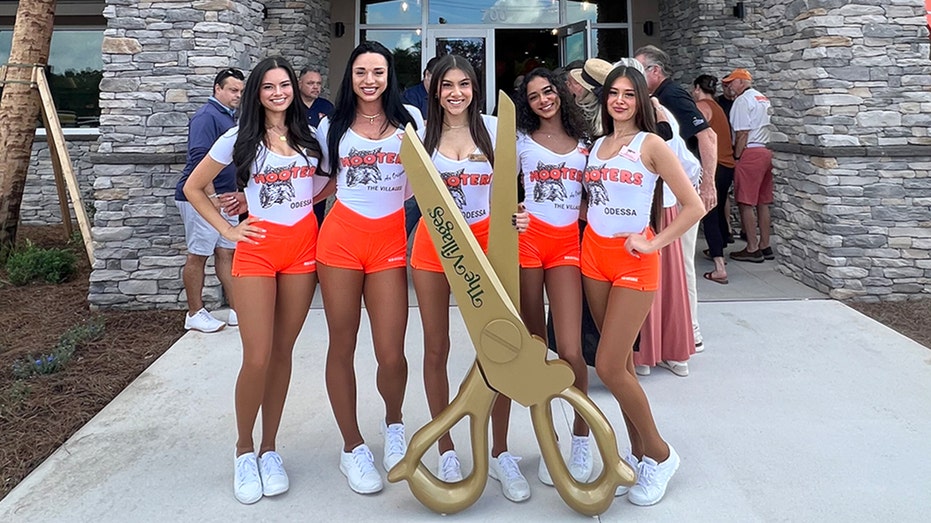 Hooters employees in new uniforms.