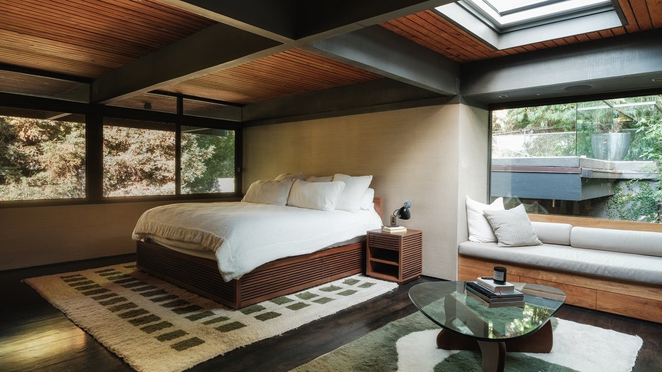 The master bedroom features skylights and large windows,