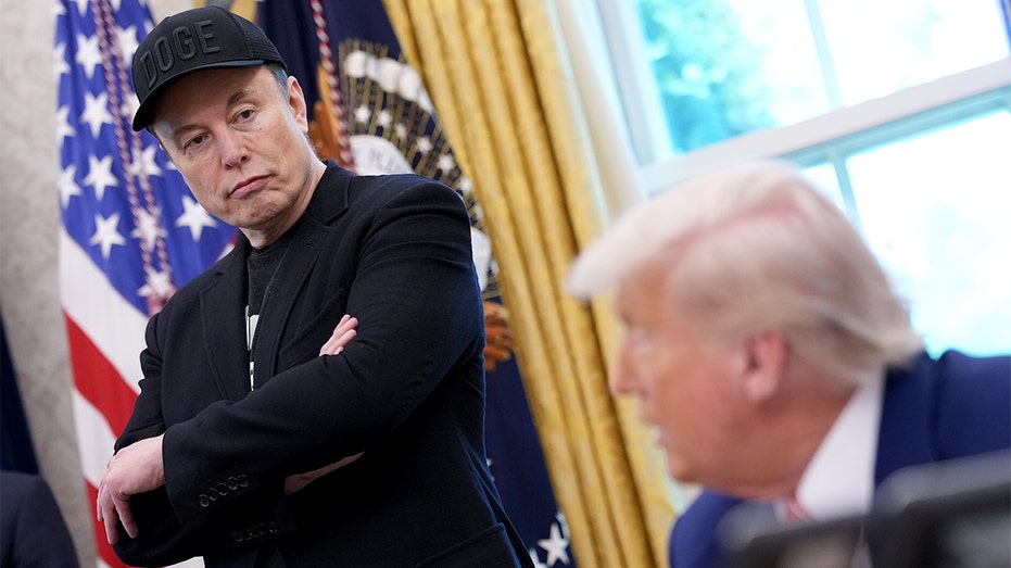 Elon Musk listens attentively during a meeting with President Donald Trump in the Oval Office.