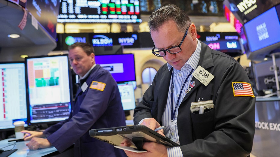 Traders on floor of New York Stock Exchange