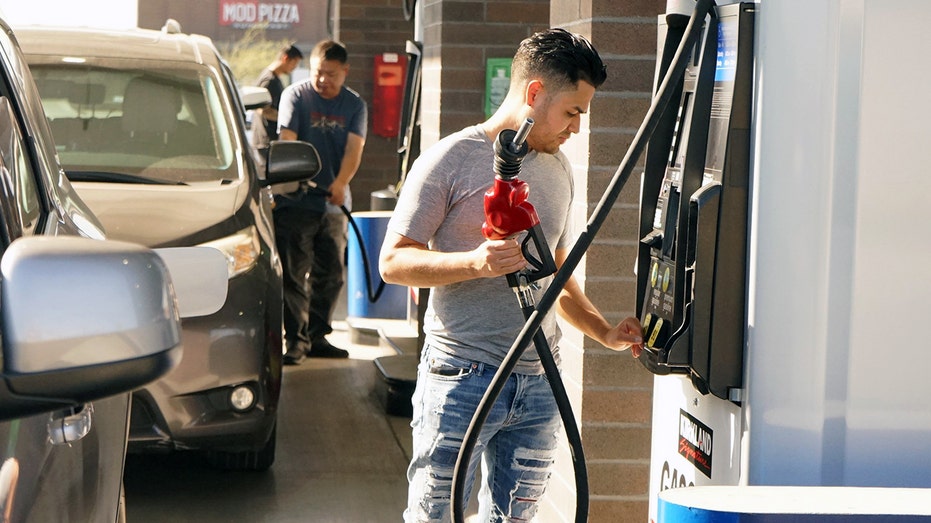 Customers fill their cars at a gas station in Los Angeles.