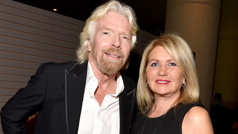 Richard Branson and Joan Templeman posing for a photo together
