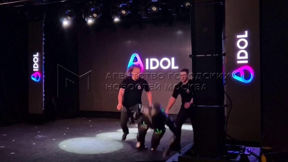 AI Robot falling on stage.