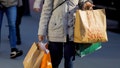 A woman carries shopping bags during the holiday season in New York City, Dec. 21, 2022. - Fox News