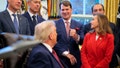 Ford CEO Jim Farley (center) speaks to U.S. President Donald Trump as Trump makes an announcement on changes to the country's fuel economy standards in the Oval Office at the White House on December 3, 2025, in Washington, D.C. - Fox News