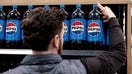 A worker arranges bottles of Pepsi on a shelf at a supermarket in Clifton Park, New York, US, on Friday, Feb. 2, 2024. PepsiCo Inc. is scheduled to release earnings figures on February 9. Photographer: Angus Mordant/Bloomberg via Getty Images - Fox Business News