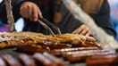 A grilled sausage and steak vendor at a Christmas market in Berlin, Germany, on Saturday, Dec. 13, 2025.  - Fox Business News