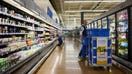 Workers stock shelves in a grocery aisle at a Walmart store on Black Friday in Columbus, Ohio, on Nov. 28, 2025. - Fox Business News