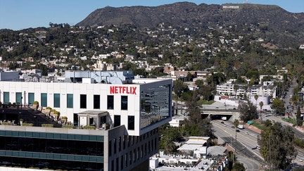 A drone view shows the Netflix logo on one of their buildings in the Hollywood neighborhood of Los Angeles, California, December 8, 2025. - Fox Business News