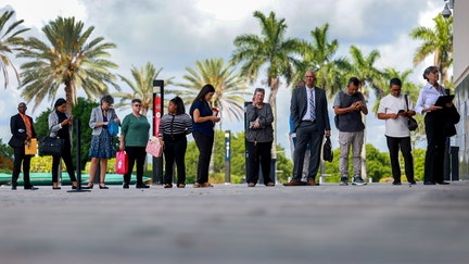 People line up as they wait for a job fair to open at the Amerant Bank Arena on June 26, 2024, in Sunrise, Florida. - Fox Business News