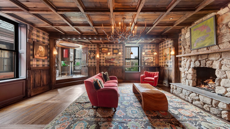 The great room features a traditional fireplace.