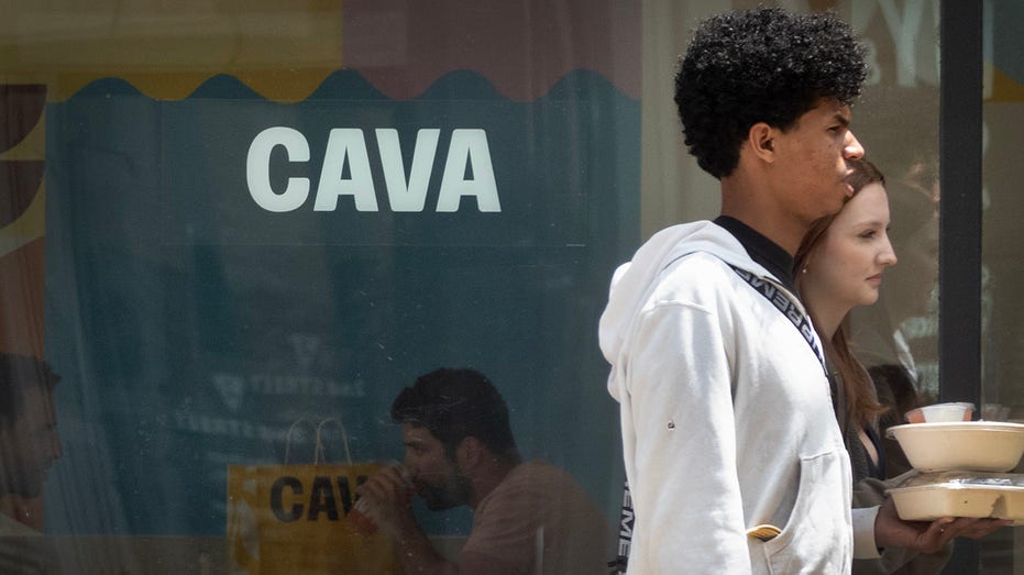 Customers take out food from a CAVA restaurant in Chicago.