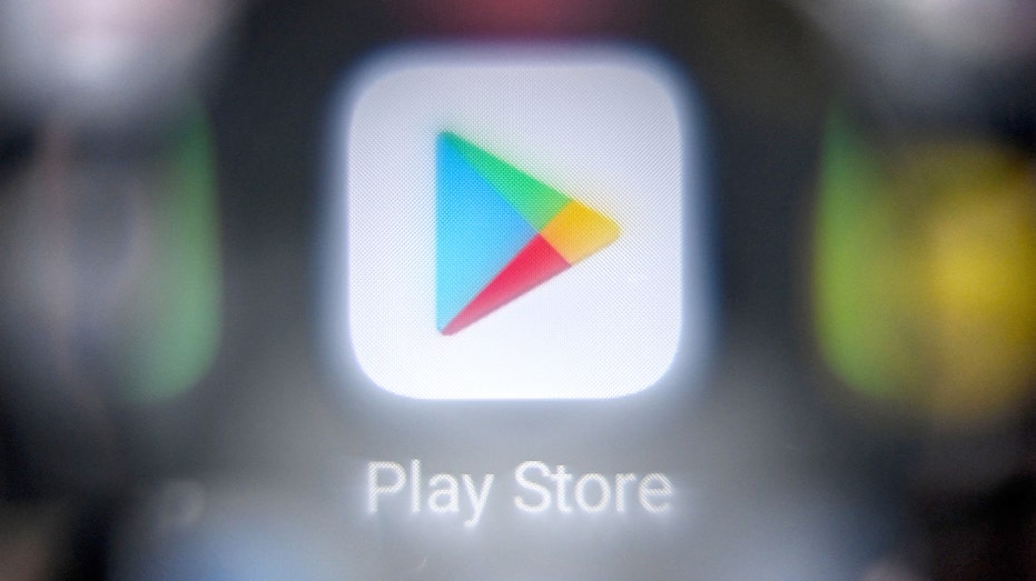 A smartphone displays the Google Play logo in a staged tech-related image.