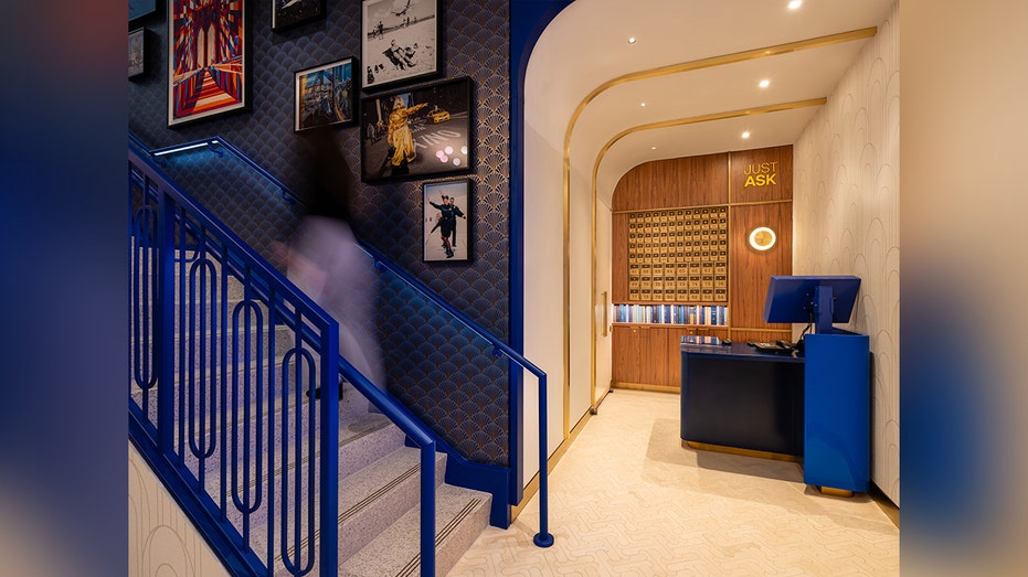 blue walls and stairs at airport lounge