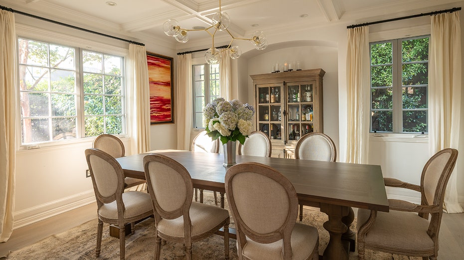 The dining room boasts a table large enough for eight guests.