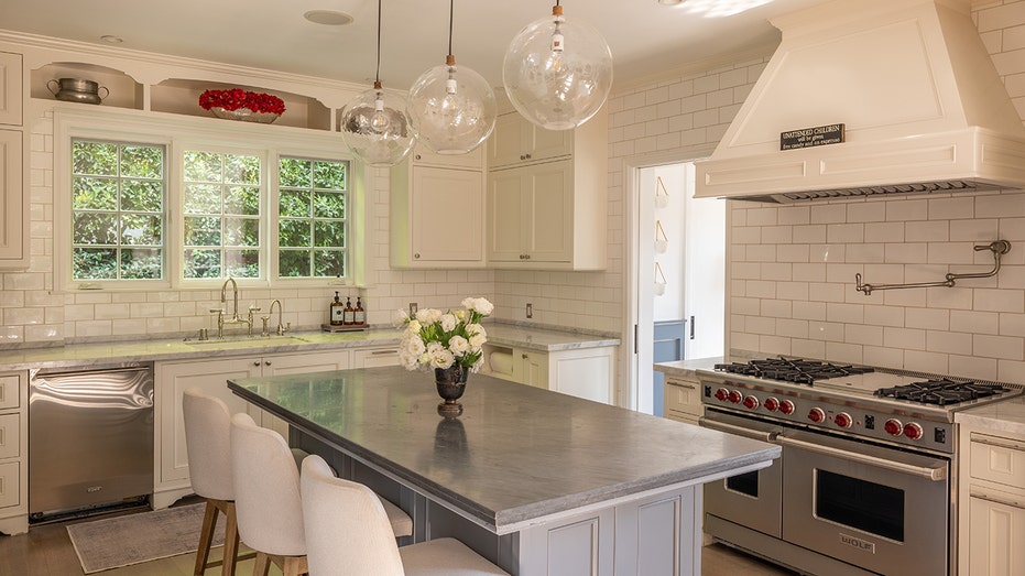 The kitchen features a large center eat-in island.