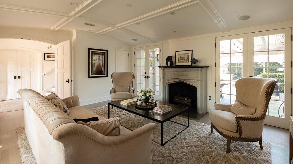 The living room features a wood-burning fireplace.