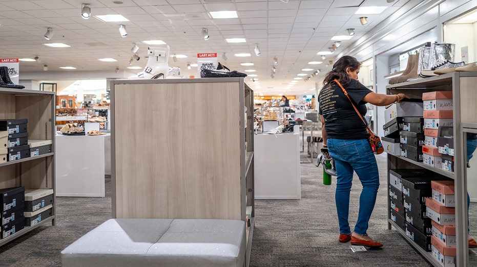 A customer shops for shoes in a Macy's store in Austin.