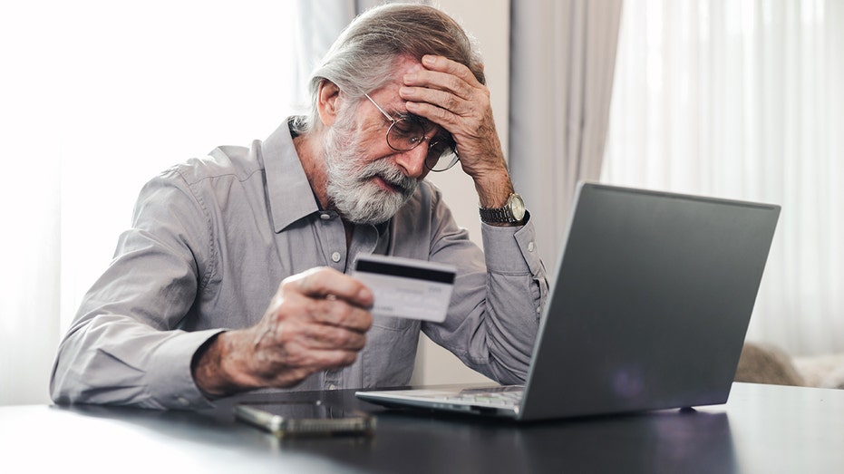 Elderly man stresses over credit card