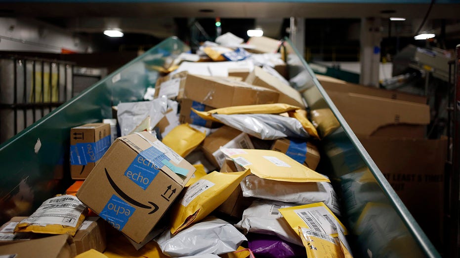 Amazon.com Inc. packages are seen on a conveyor belt