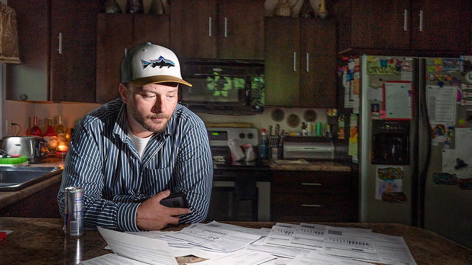 man at the table with expensive bills