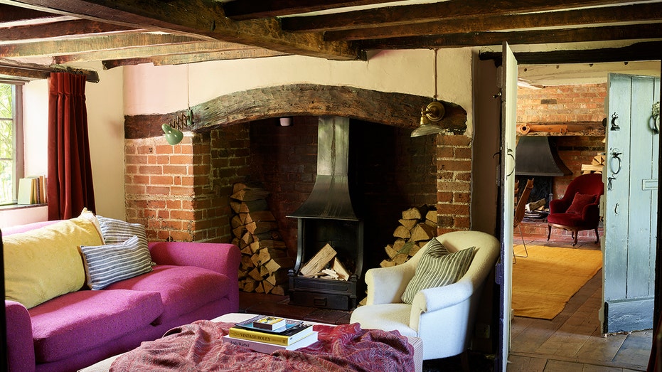 The home features a large wood-burning fireplace in the living room.