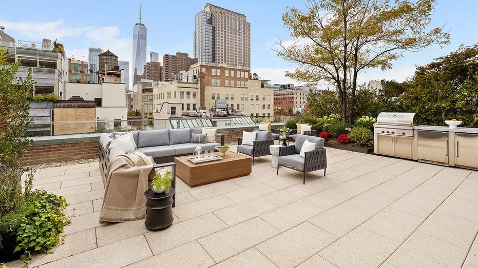 The home also includes 1,000-square-feet of outdoor space with an outdoor kitchen and lounge space.