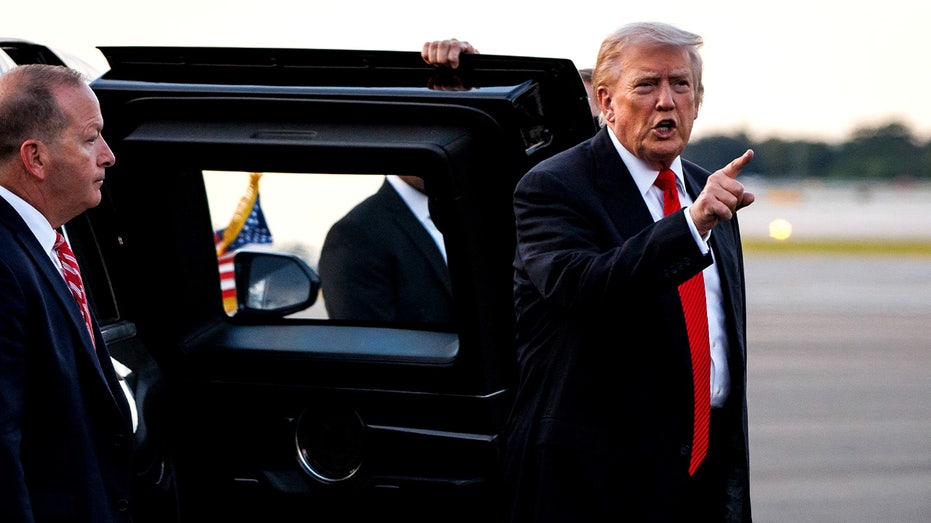 Trump exits presidential vehicle
