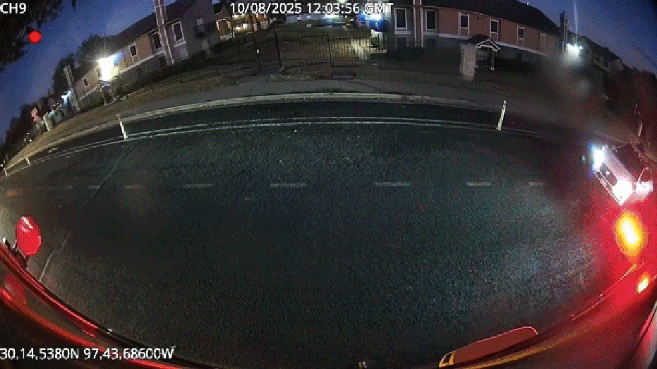 white waymo car passes school bus stop signs