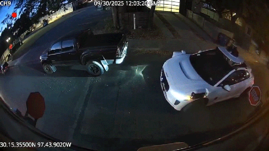 white waymo car passes school bus stop signs