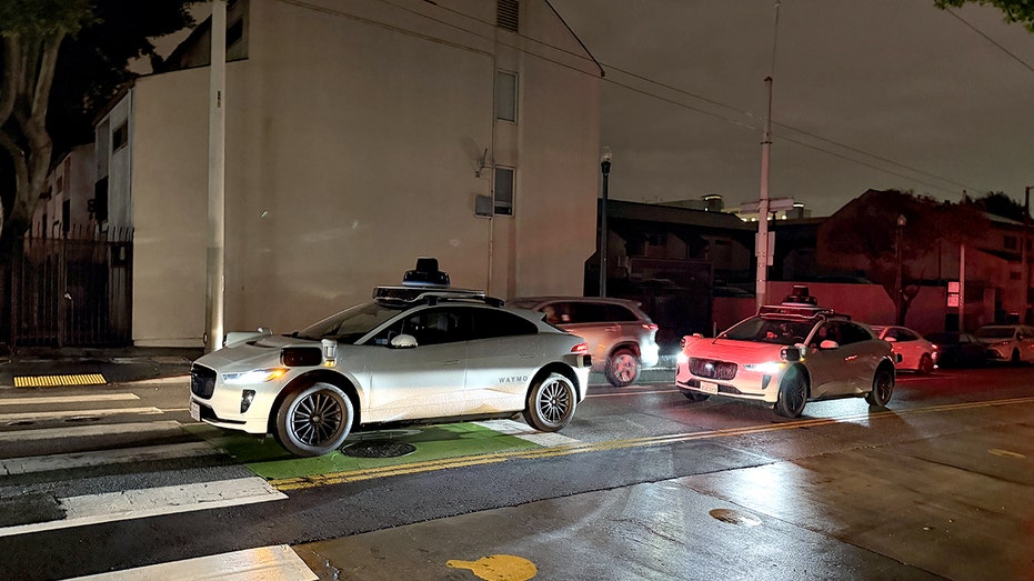 Waymo driverless cars stopped at an intersection