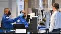 TSA agents check passenger identity documents at a security checkpoint security at Reagan National Airport on the first day of the US government shut down in Arlington, Va., on Oct.1, 2025 - Fox News
